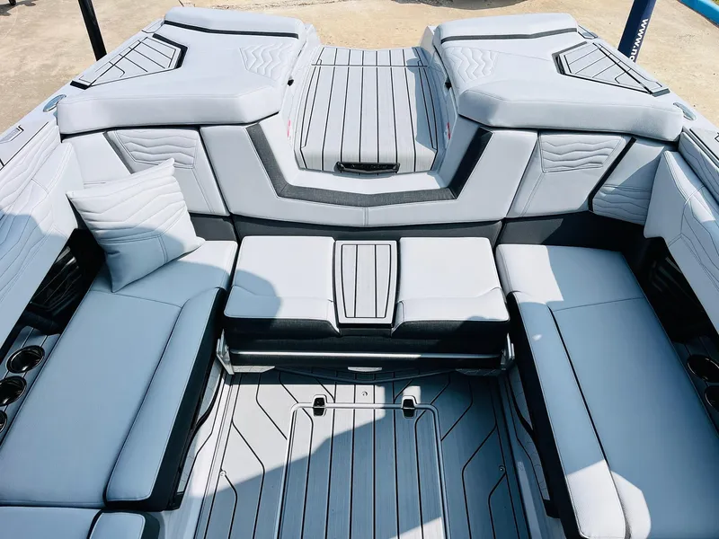 Slide: The Image of 2025 Nautique Super Air G23 boat interior with sleek, modern seating and stylish design. - 34