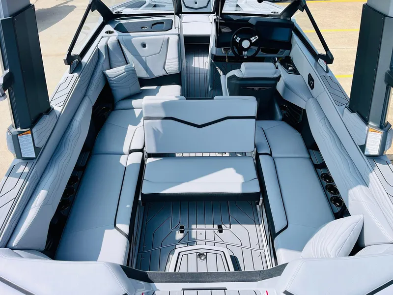 Slide: The Image of 2025 Nautique Super Air G23 boat interior with spacious seating and modern design. - 37
