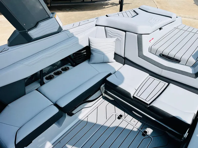 Slide: The Image of 2025 Nautique Super Air G23 interior with sleek seating and modern design. - 41