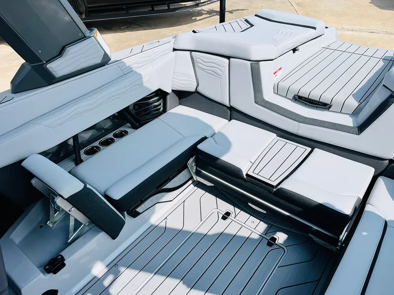 Slide: The Image of 2025 Nautique Super Air G23 interior with sleek seating and modern design. - 44
