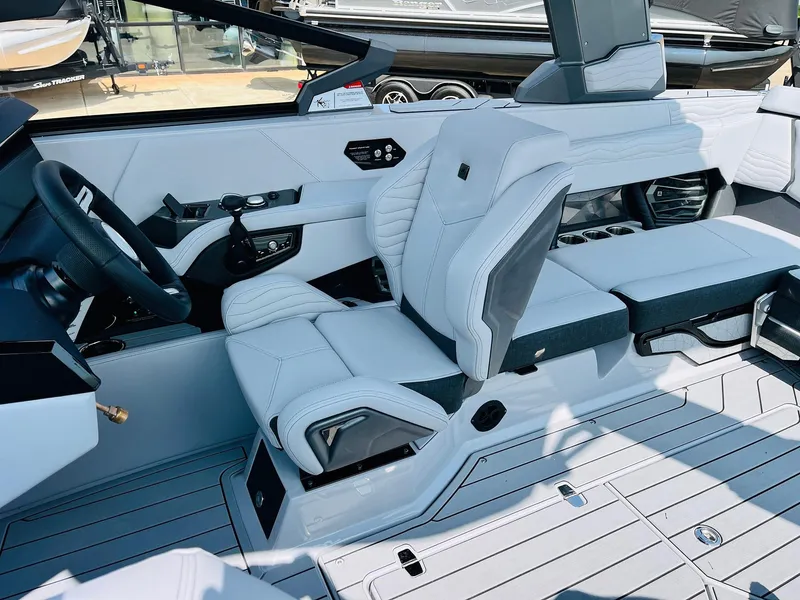 Slide: The Image of 2025 Nautique Super Air G23 interior with sleek, modern seating and advanced controls. - 47