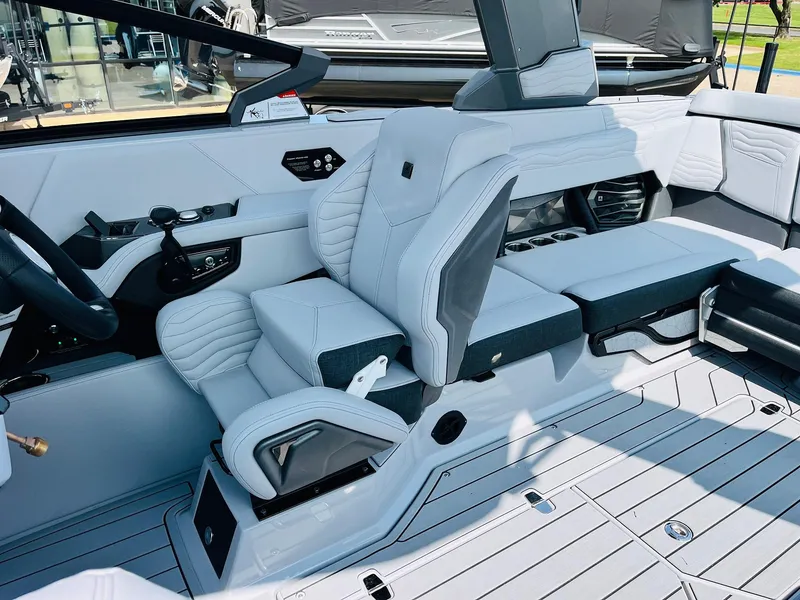 Slide: The Image of 2025 Nautique Super Air G23 interior with sleek, modern seating and advanced controls. - 48