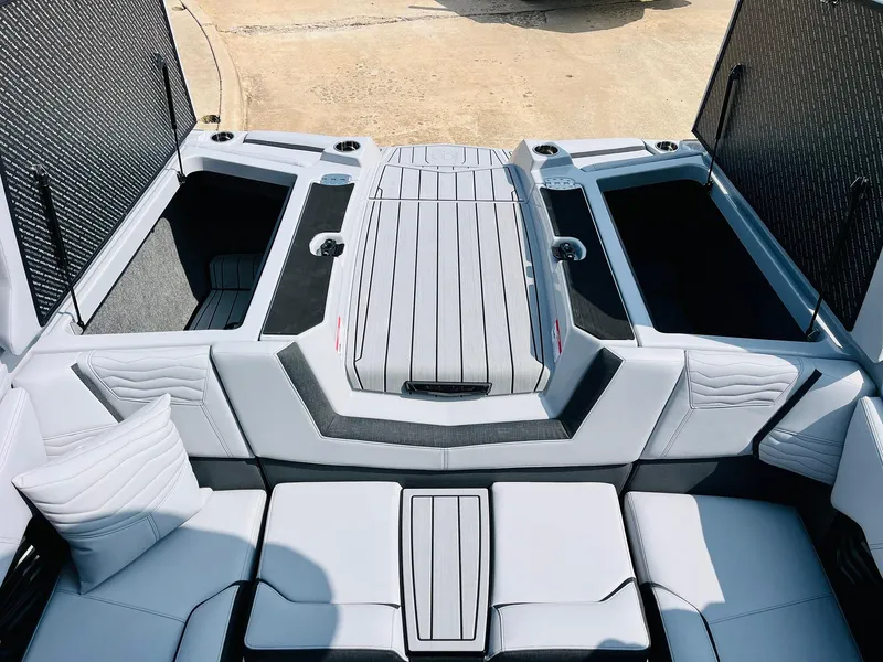 Slide: The Image of 2025 Nautique Super Air G23 boat interior with sleek seating and storage compartments. - 51