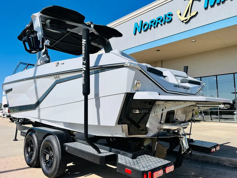 Slide: The Image of 2025 Nautique Super Air G23 boat on trailer at Norris Marine dealership. - 6