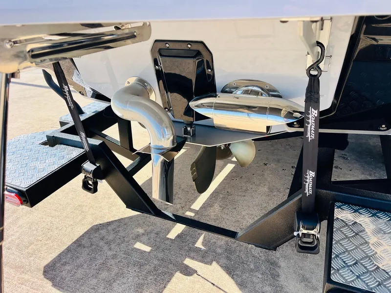 Slide: The Image of 2025 Nautique Super Air G23 boat propeller and exhaust system, close-up view. - 8