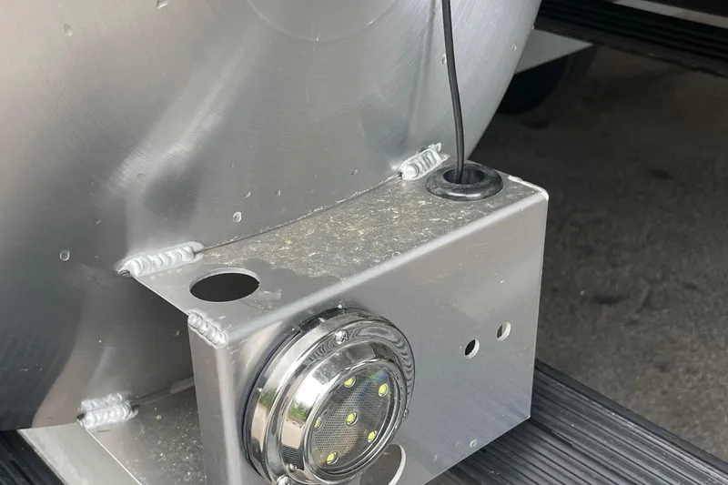 Slide: The Image of Close-up of Barletta L25MAT 2025 boat component with wiring and LED light. - 12