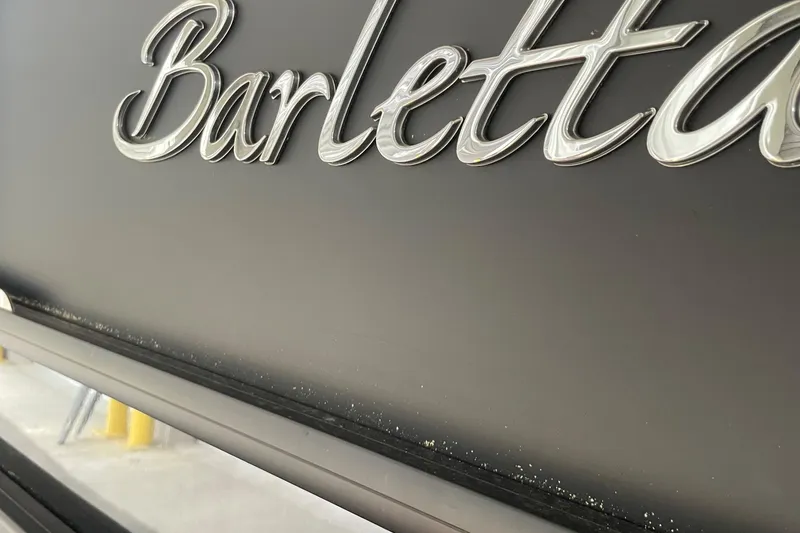 Slide: The Image of Close-up of Barletta L25MAT 2025 logo on a sleek black surface. - 15