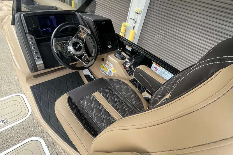 Slide: The Image of Luxurious interior of 2025 Barletta L25MAT boat with sleek steering and plush seating. - 4