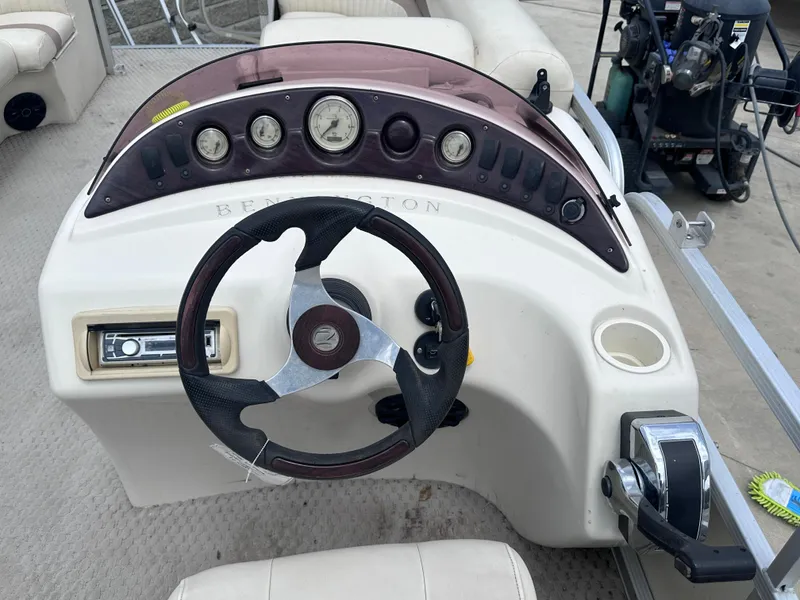 Slide: The Image of 2007 Bennington 2075GSi boat dashboard with steering wheel and control panel. - 5