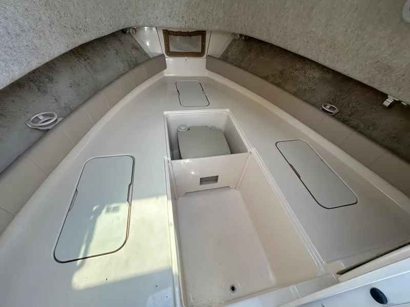Slide: The Image of 2006 Grady-White Adventure 208 boat interior with storage compartments and seating. - 6