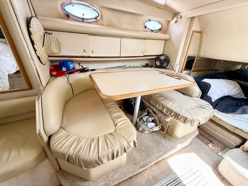 Slide: The Image of Engine compartment of a 1998 Sea Ray 330 Sundancer boat, showcasing detailed mechanical components. - 14