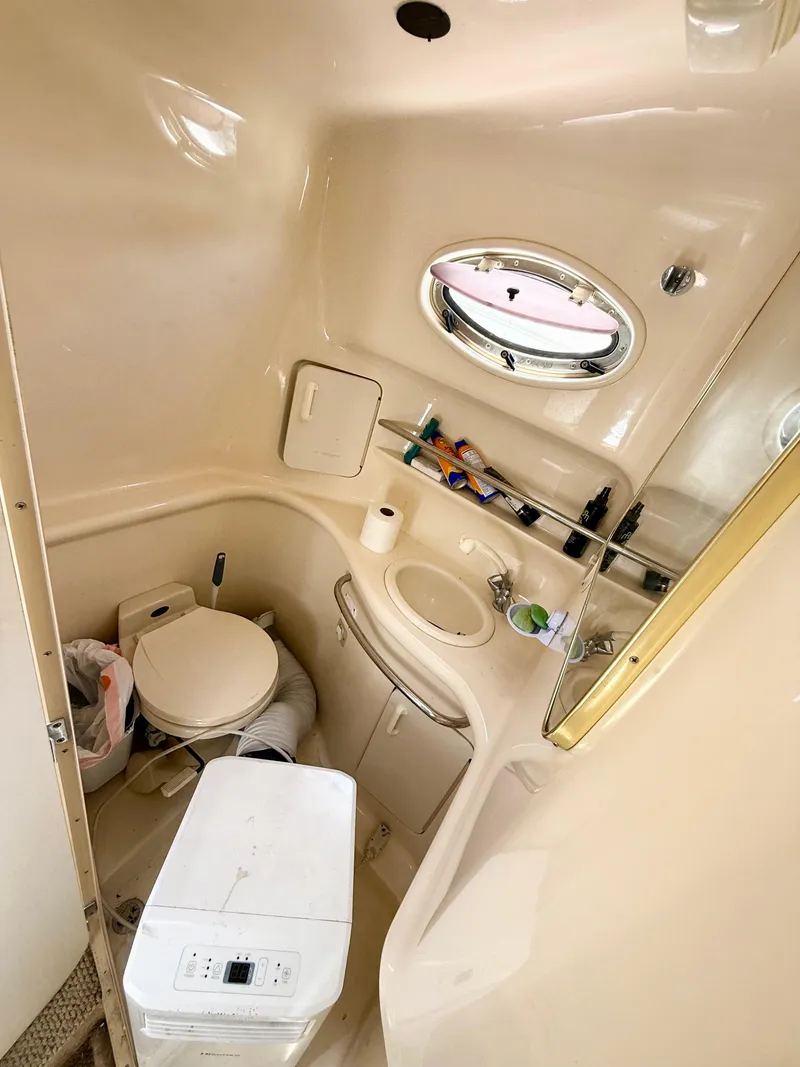 Slide: The Image of Engine compartment of a 1998 Sea Ray 330 Sundancer boat, showing mechanical components. - 17