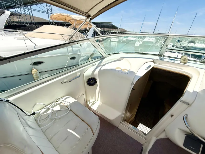 Slide: The Image of Interior of 1998 Sea Ray 330 Sundancer with kitchenette and cozy sleeping area. - 9