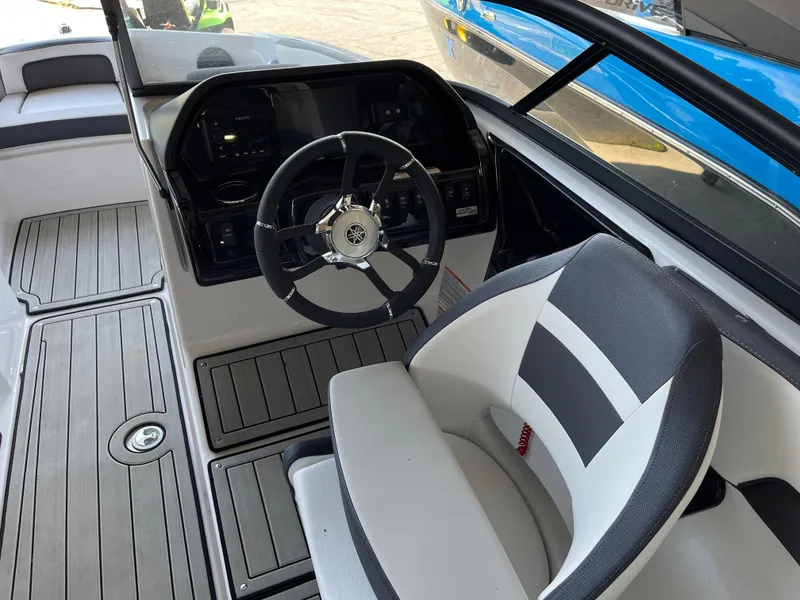 Slide: The Image of 2025 Yamaha Boats 195S cockpit with steering wheel and modern dashboard. - 4