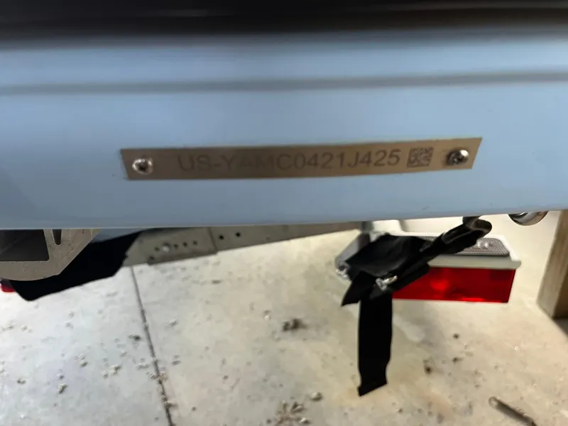 Slide: The Image of 2025 Yamaha Boats AR190 hull identification number plate on a trailer. - 19