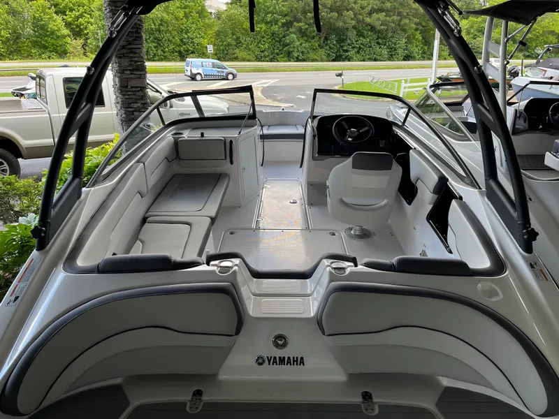 Slide: The Image of 2025 Yamaha AR190 boat interior with sleek seating and modern dashboard design. - 2