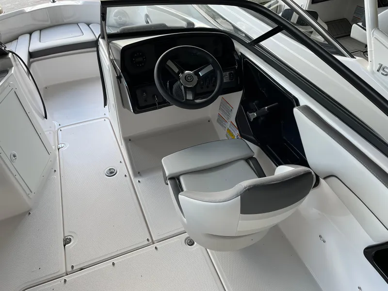 Slide: The Image of 2025 Yamaha Boats AR190 interior cockpit with steering wheel and seating. - 5