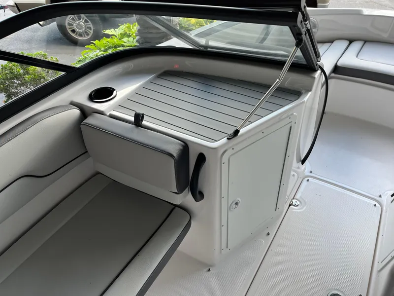 Slide: The Image of 2025 Yamaha AR190 boat interior with seating and storage compartment. - 7