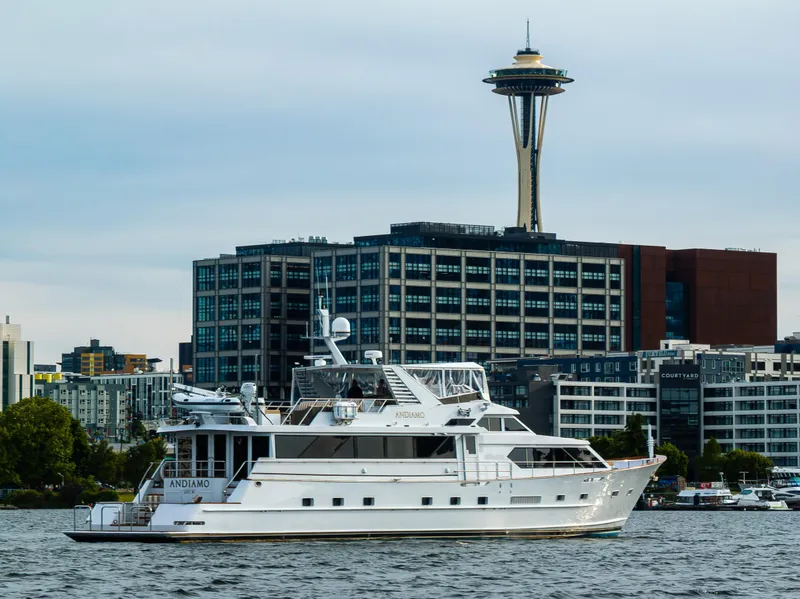 Slide: The Image of Luxury yacht Broward 102 (1991) on water with Seattle skyline and Space Needle. - 3
