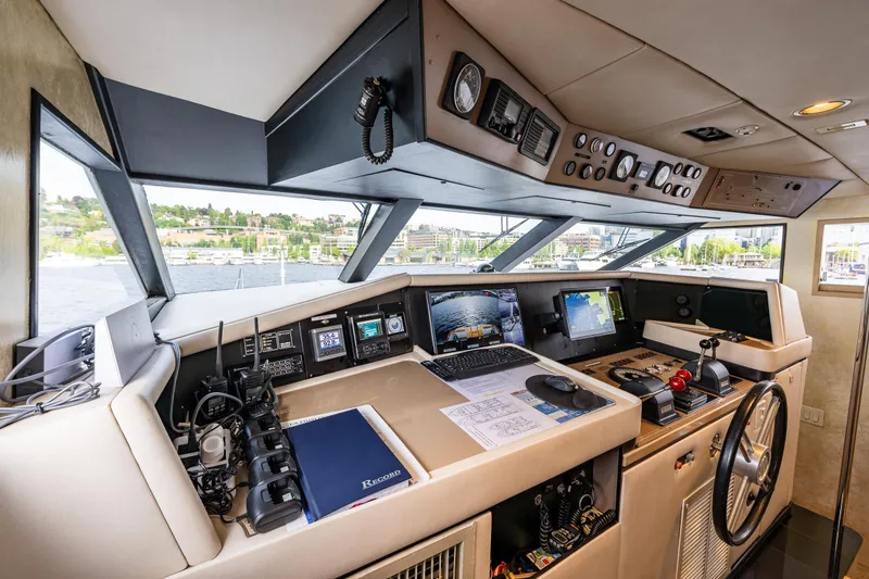 Slide: The Image of Cockpit of 1991 Broward 102 yacht with navigation equipment and panoramic windows. - 40