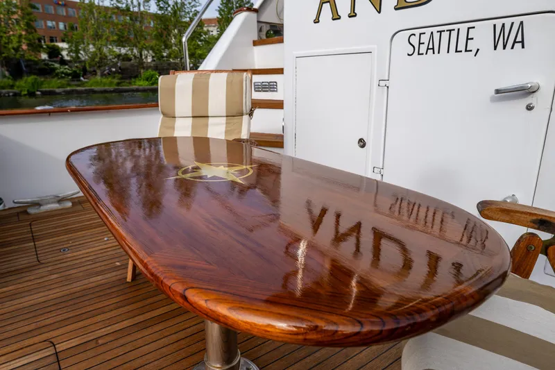 Slide: The Image of Polished wooden table on 1991 Broward 102 yacht deck, Seattle, WA. - 9