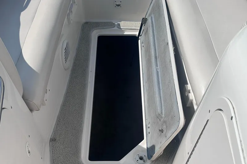 Slide: The Image of Open storage compartment on 1999 Chaparral 210 Sunesta boat interior. - 24