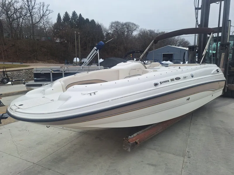 Slide: The Image of 1999 Chaparral 210 Sunesta boat on a dock, ready for water adventures. - 28