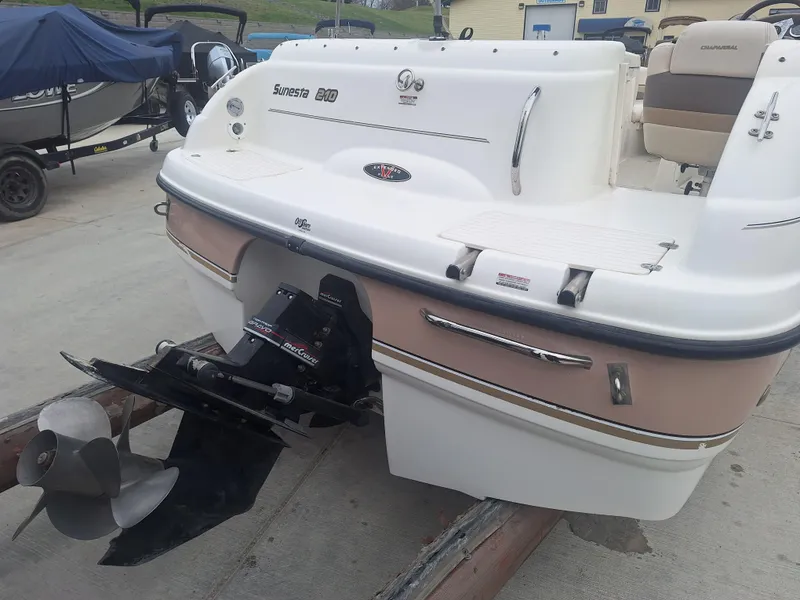 Slide: The Image of 1999 Chaparral 210 Sunesta boat rear view with outboard motor on trailer. - 32