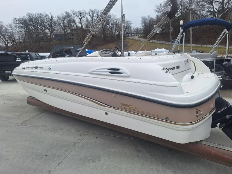Slide: The Image of 1999 Chaparral 210 Sunesta boat on trailer, parked outdoors. - 42
