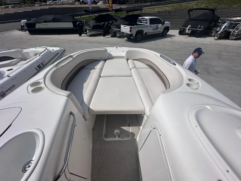 Slide: The Image of 1999 Chaparral 210 Sunesta boat interior with spacious seating and sun deck. - 7