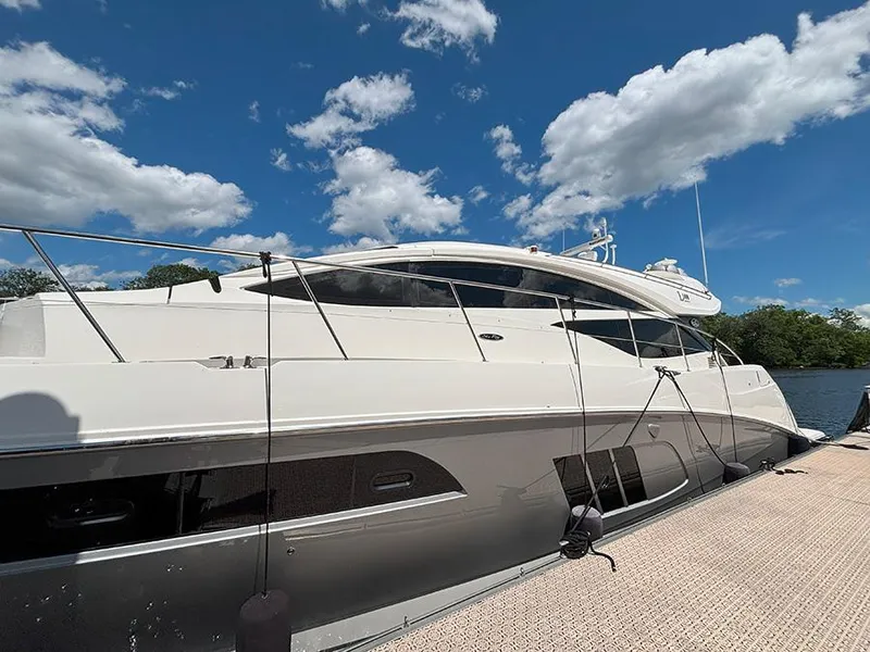 The Image of 2017 Sea Ray L590 yacht docked under a clear blue sky. - 0