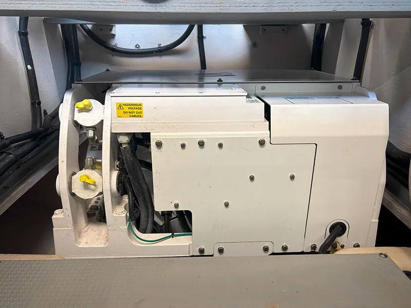 Slide: The Image of Engine compartment of a 2017 Sea Ray L590 yacht, showcasing mechanical components. - 13