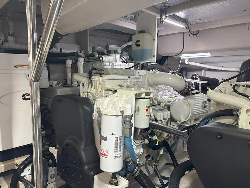 Slide: The Image of Engine room of a 2017 Sea Ray L590 yacht, showcasing mechanical components and systems. - 15