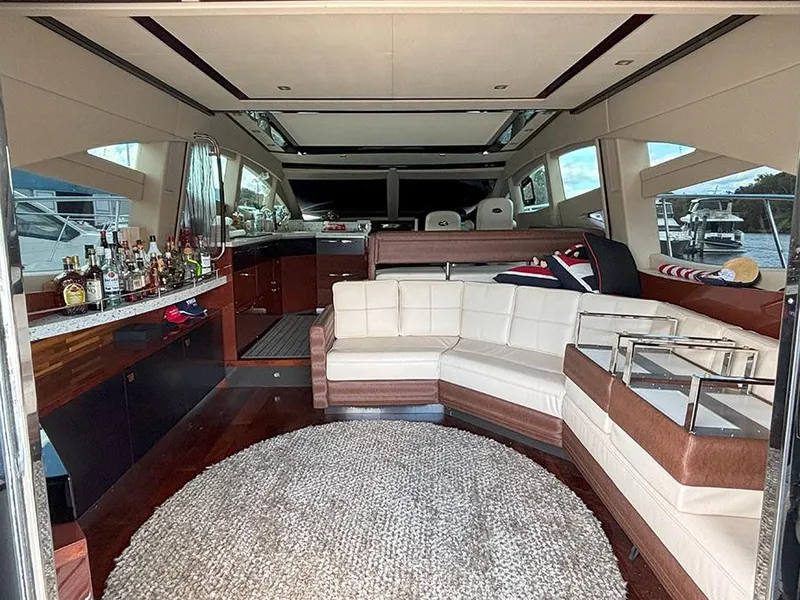 Slide: The Image of Luxurious interior of 2017 Sea Ray L590 yacht with plush seating and bar area. - 19