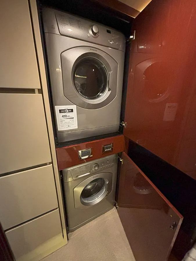 Slide: The Image of Stacked washer and dryer in 2017 Sea Ray L590 yacht interior. - 3