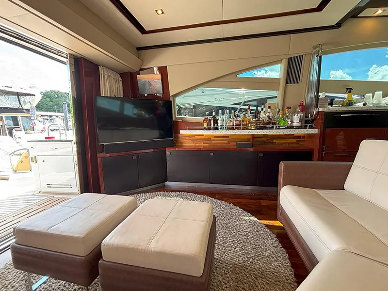 Slide: The Image of Luxurious interior of 2017 Sea Ray L590 yacht with modern seating and entertainment area. - 31