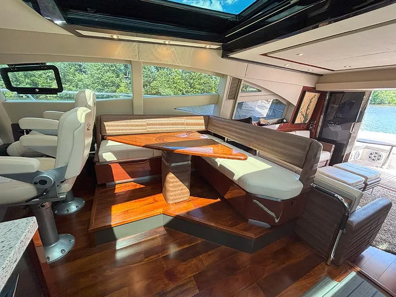 Slide: The Image of Luxurious interior of 2017 Sea Ray L590 yacht with elegant seating and wooden flooring. - 32