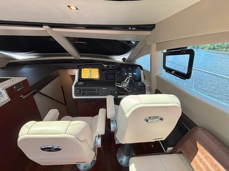 Slide: The Image of Interior of 2017 Sea Ray L590 yacht cockpit with modern navigation equipment. - 34