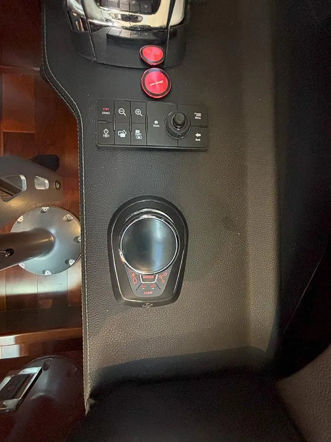 Slide: The Image of Control panel of a 2017 Sea Ray L590 yacht with joystick and buttons. - 38