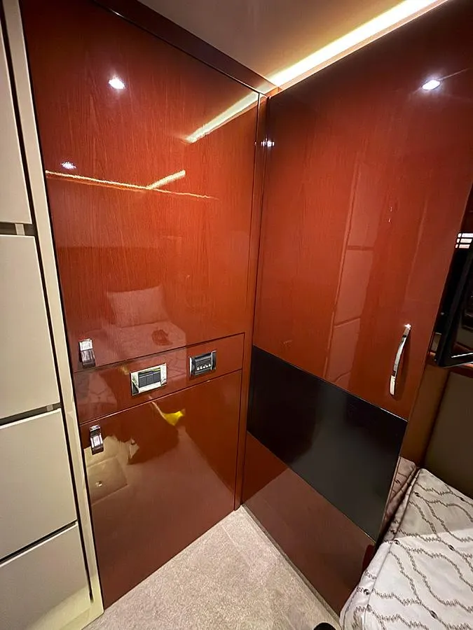 Slide: The Image of Interior of 2017 Sea Ray L590 yacht with sleek wooden cabinetry and modern design. - 4