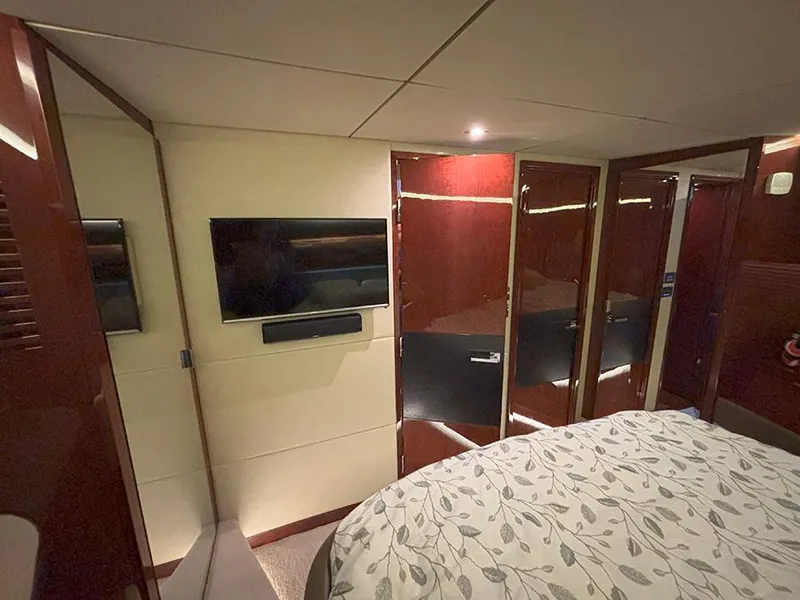 Slide: The Image of Luxurious interior of 2017 Sea Ray L590 yacht with TV and elegant wood finishes. - 46