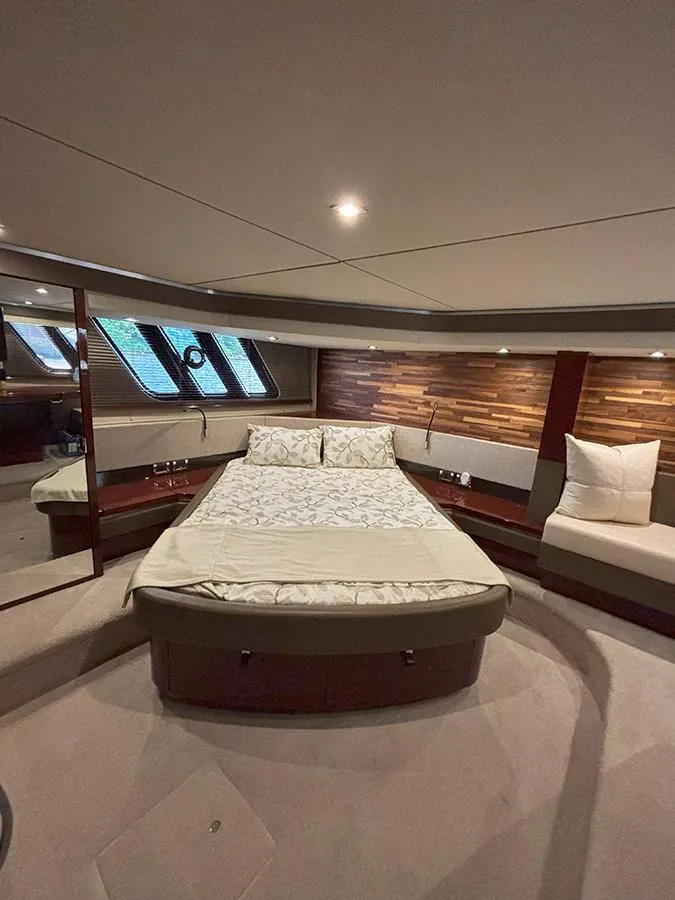 Slide: The Image of Luxurious interior of 2017 Sea Ray L590 yacht with elegant bed and seating area. - 48