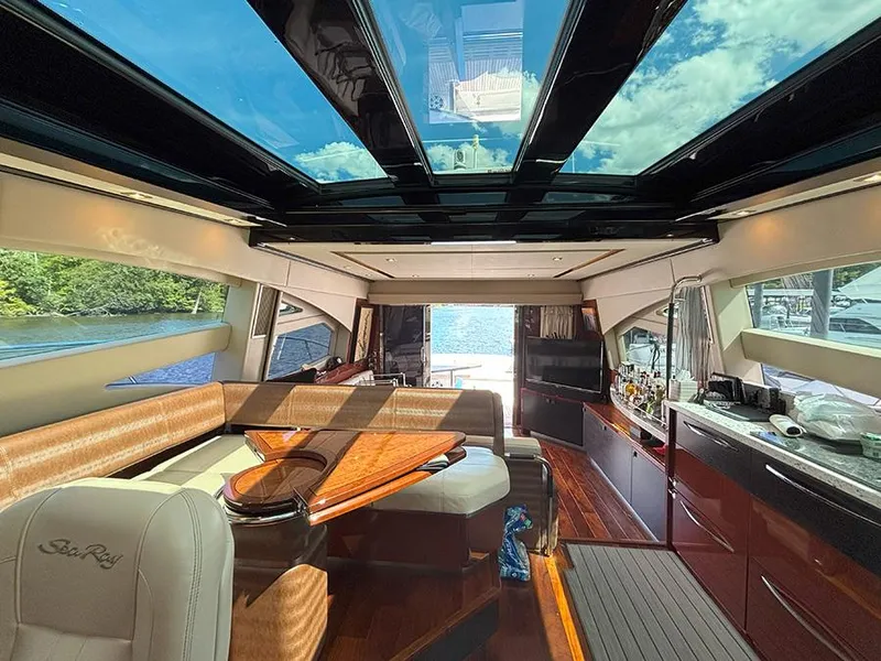 Slide: The Image of Luxurious interior of 2017 Sea Ray L590 yacht with panoramic windows and elegant furnishings. - 6
