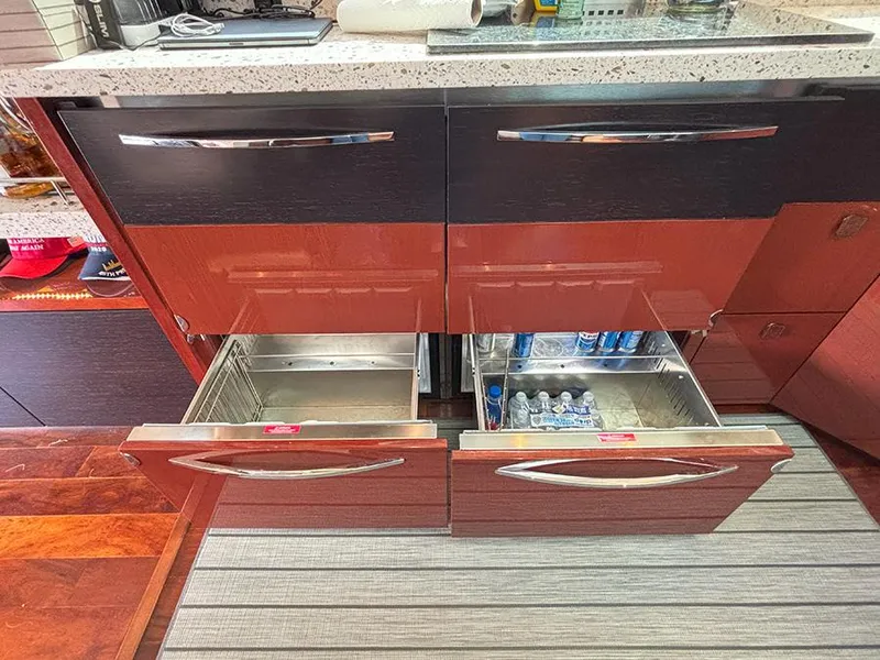 Slide: The Image of Modern kitchen drawers in 2017 Sea Ray L590 yacht, featuring sleek design and ample storage. - 7