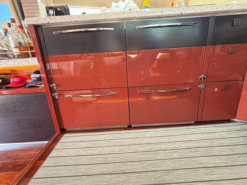 Slide: The Image of 2017 Sea Ray L590 yacht interior with sleek cabinetry and modern design. - 8