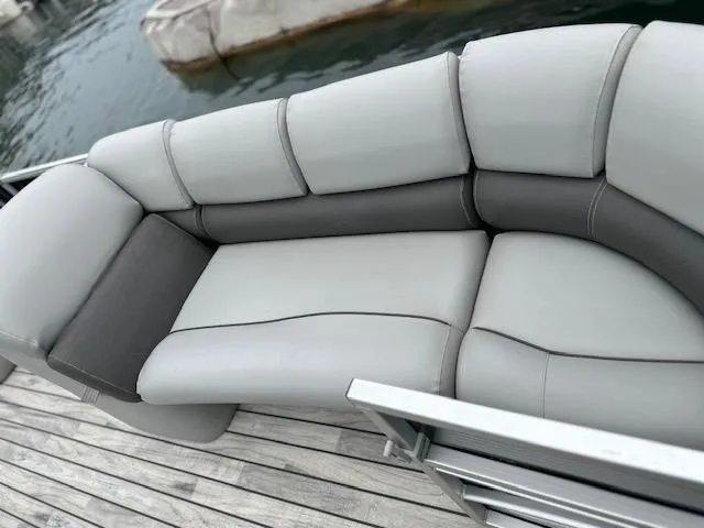 Slide: The Image of Luxurious seating on 2015 Silver Wave 230 Island CL pontoon boat at dock. - 4