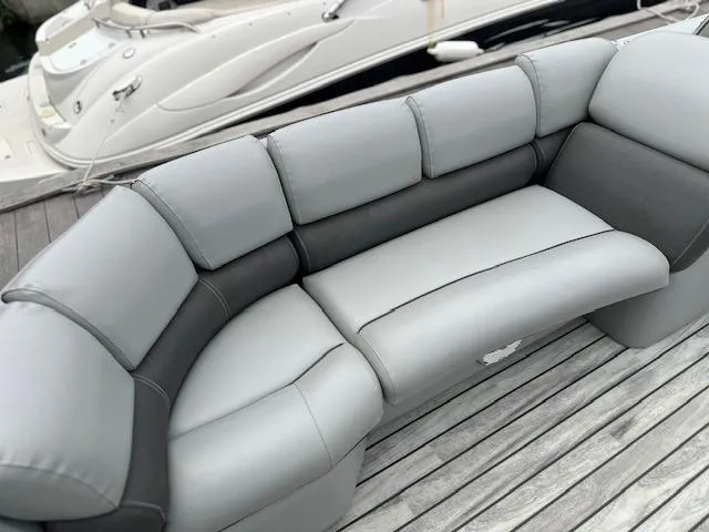 Slide: The Image of Gray and black seating on 2015 Silver Wave 230 Island CL boat, docked on wooden pier. - 5