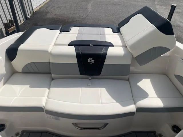 Slide: The Image of 2022 Chaparral 21 Surf boat with sleek seating and modern design. - 7