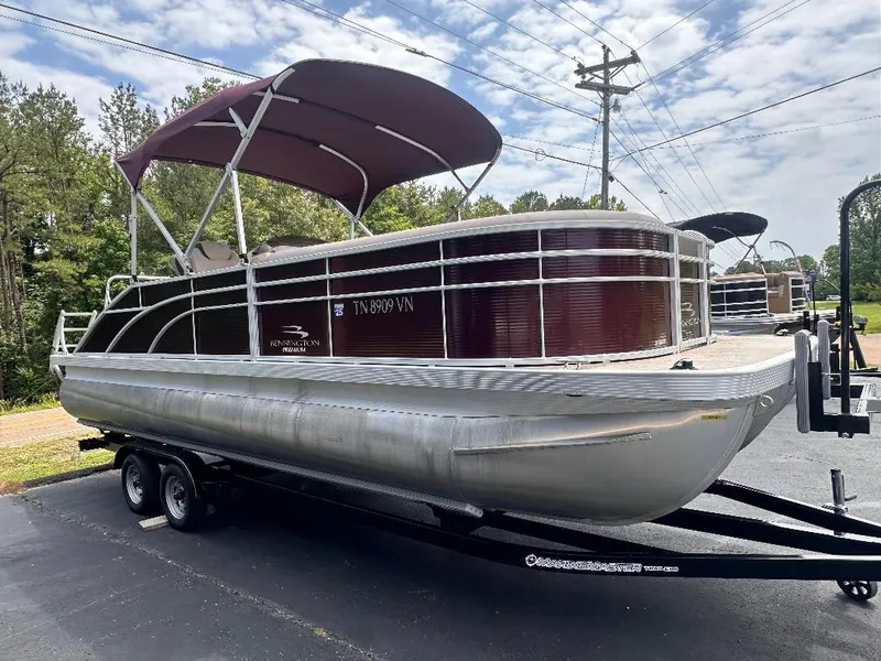 Slide: The Image of 2018 Bennington 23SSBXP pontoon boat with Yamaha F150 engine on trailer. - 3