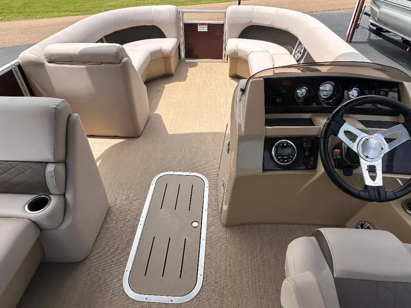 Slide: The Image of 2018 Bennington 23SSBXP pontoon boat interior with Yamaha F150, featuring plush seating and modern dashboard. - 4